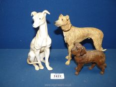 A china Whippet, wooden Lurcher plus another wooden dog.