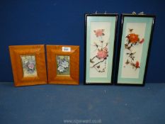 A pair of oriental Diorama of birds, flowers and feathers, framed, glazed and signed,