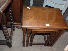 A mid Oak Nest of three rectangular occasional Tables having turned legs,