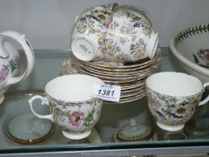 A part English bone china Teaset in anemone pattern including six teacups,
