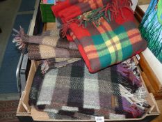 A Derw Welsh wool blanket and two Scottish blankets in tartan pattern.