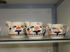 Three gaudy Welsh Oyster pattern jugs,