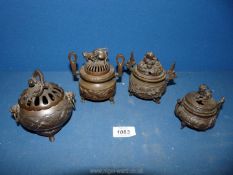 Four small Chinese bronze incense burners, all with different animal finials (4 1/2" highest).