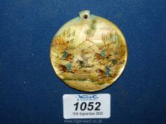 A large mother of pearl medallion painted with an oriental hunting scene, 2 1/4".