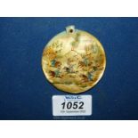 A large mother of pearl medallion painted with an oriental hunting scene, 2 1/4".