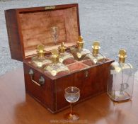 A 19th century light and dark wood strung and inlaid Mahogany/Walnut cased six bottle Decanter Set,