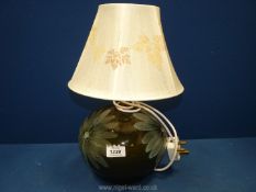 A china ''Lotus'' pottery table Lamp with shade decorated with pressed leaves, 15" tall.