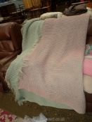 A double honeycomb Welsh Wool blanket in green and pink.