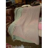 A double honeycomb Welsh Wool blanket in green and pink.