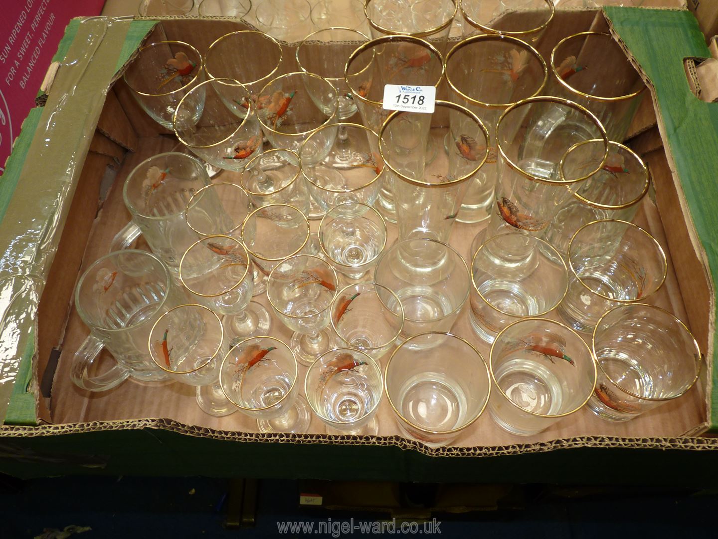 A quantity of glasses with gilt rims and pheasants to front including lemonade glasses,