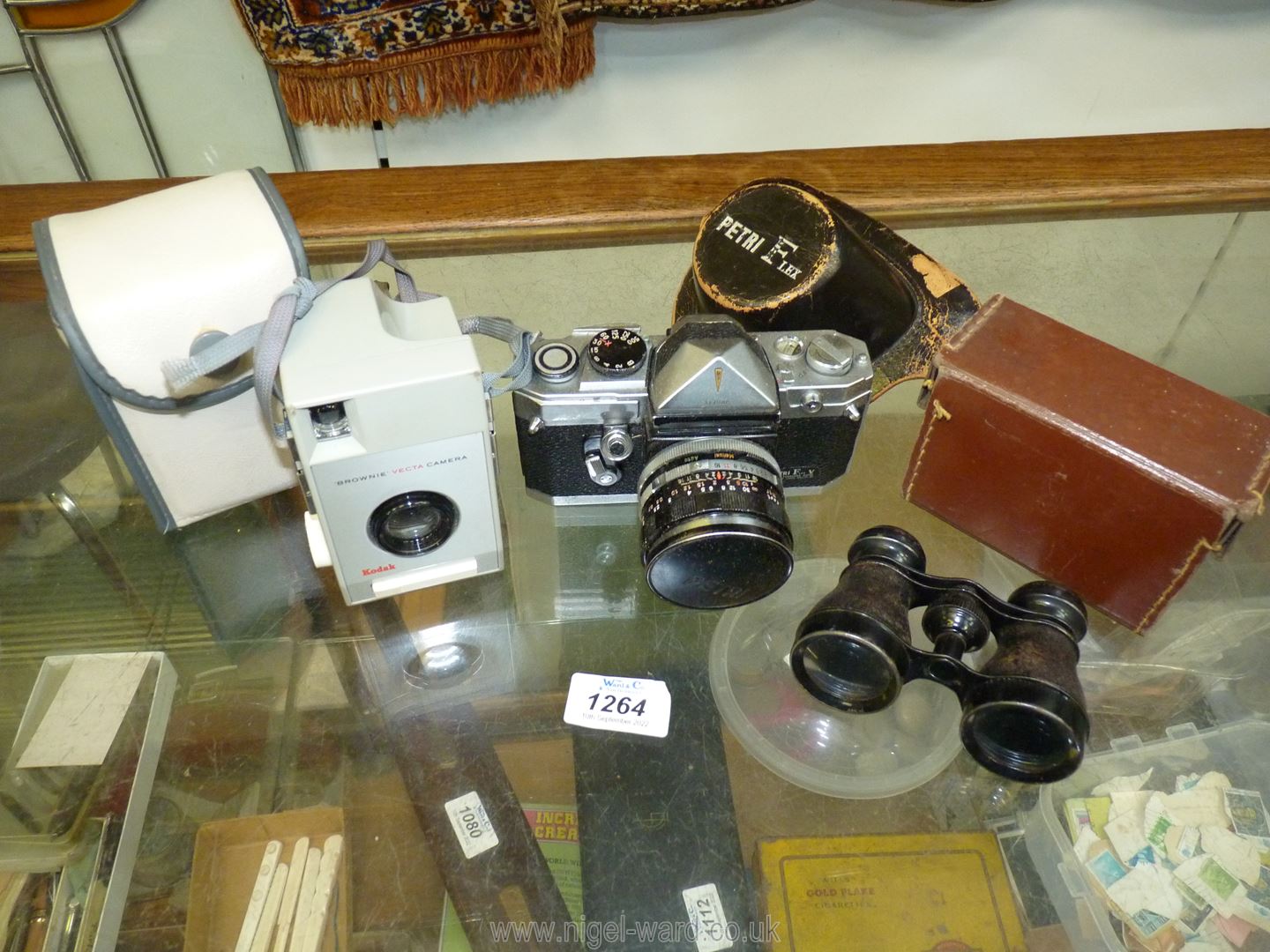 A pair of field glasses in small case,