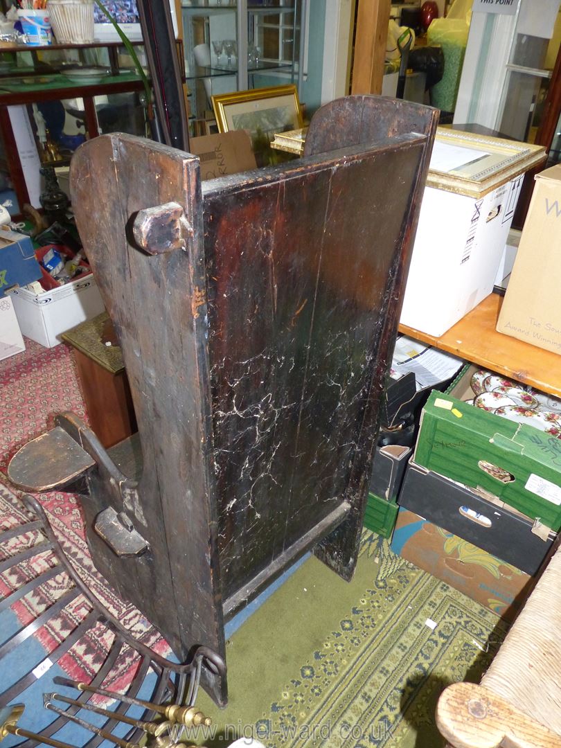 A very rustic dark stained peg joyned lambing style Armchair having a small shelf incorporated to - Image 3 of 5