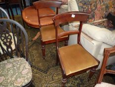 A pair of Victorian Mahogany Side Chairs with tapering octagonal front legs and drop in gold velvet
