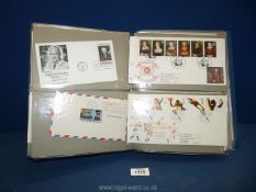 A folder of First Day covers, stamps and coins including; Apollo landing, etc.