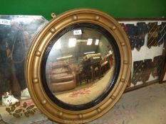 A large gilt convex mirror, 2' diameter.