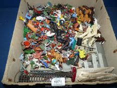 A quantity of plastic Cowboys and Indians and farm animals, etc.