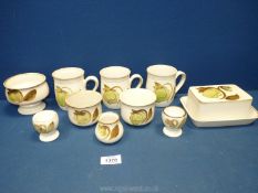 A quantity of Denby Troubadour pottery including butter dish, three mugs, two egg cups, vase,