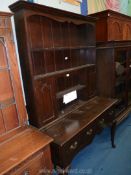 A dark Oak Dresser, the base on cabriole legs having a pair of frieze drawers.