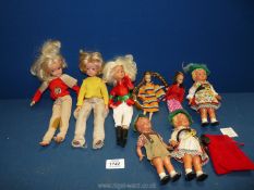 Three Sindy dolls, two smaller dolls, possibly Polly Pocket and three W. German dolls.