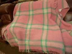 A double Derw Welsh Wool honeycomb blanket in pink, mint green and cream.