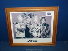 A vintage framed autographed Photograph of the heavy metal rock group 'Poison' with provenance,