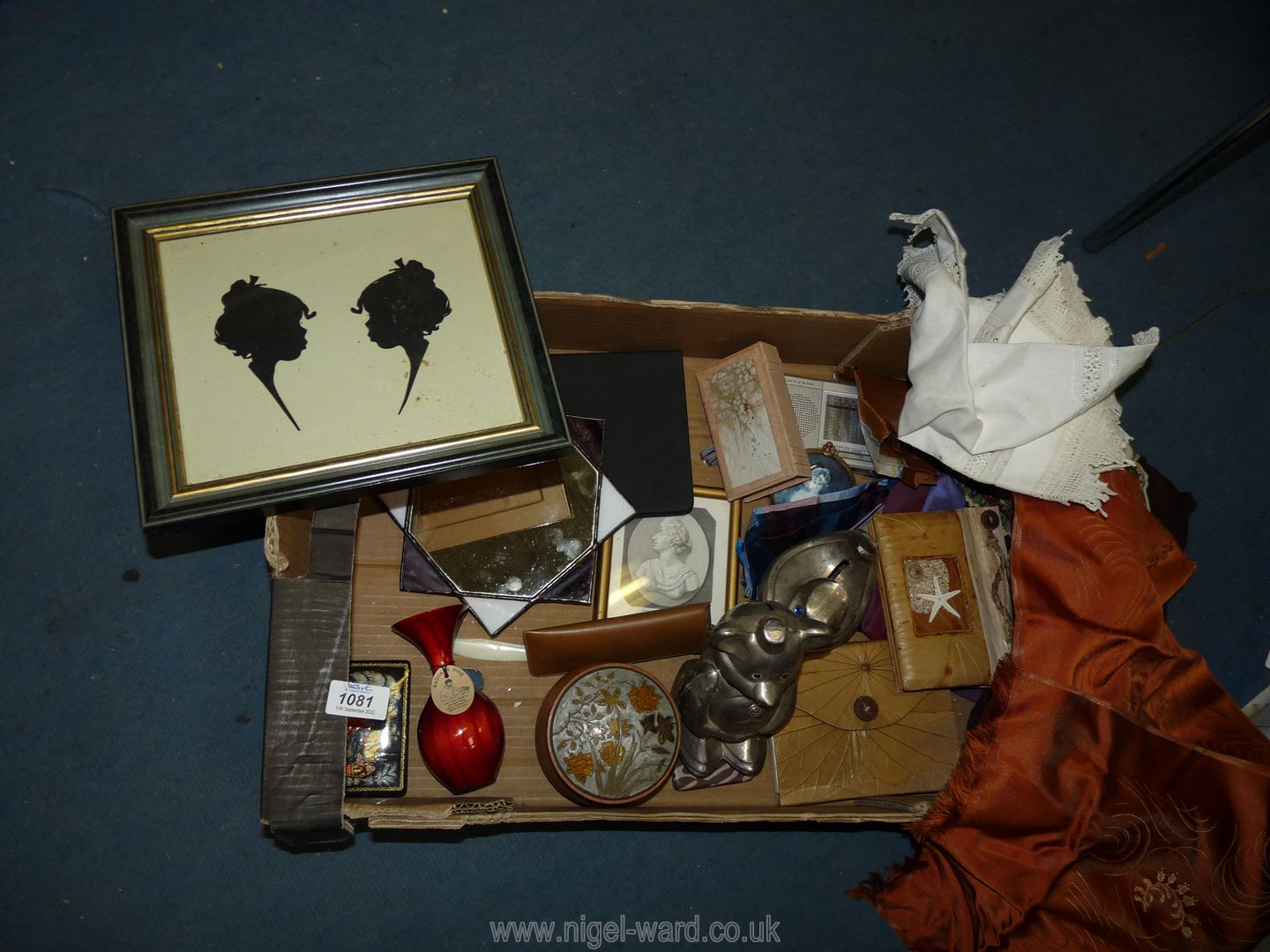 A box of miscellanea including ladies scarves, a small wooden vase from New Zealand, hand made book,