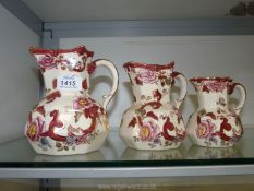 A graduated set of three Masons 'Mandalay Red' jugs.