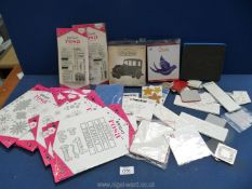 A box of craft materials to include cutting dies, assorted stamps, wooden blocks,