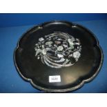 A black lacquered Tray with scalloped edge and mother of pearl inlay of birds and flowers.