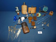 A quantity of miscellanea to include bottle stoppers, three hip flasks,