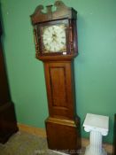 A cross-banded Oak cased 30 hour longcase Clock, the painted face with Roman numerals,