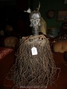 A tribal Art Kota Mahongwe reliquary figure with basket, having patinated copper sheathing,