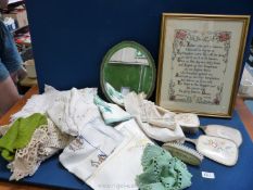 A quantity of miscellanea including bevel edged mirror, linen, brushes, etc.