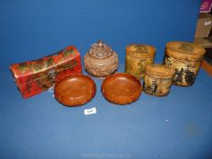 An Oriental treen bowl and cover, carved dragons, a pair of Lotus bud shaped bowls,