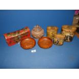 An Oriental treen bowl and cover, carved dragons, a pair of Lotus bud shaped bowls,
