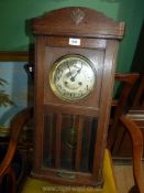 A 100 year old Wall Clock with 2 keys,