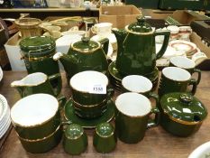 A quantity of Apilco French porcelain green china consisting of four mugs, cups,