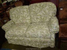 A very clean two seater Settee having Sanderson type loose cover,