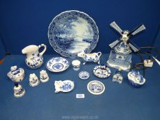 A quantity of Delft ware china including windmill lamp, salt & pepper, KLM Royal Delft house,