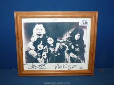 A vintage framed autographed Photograph of the heavy metal rock group 'Motley Crue',