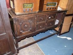 A 1930's/40's dark Oak Sideboard having two central short drawers flanked by opposing Jacobean