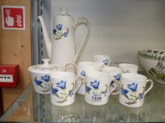 A Tuscan 'Harebell' part coffee set with six coffee cans, three saucers, coffee pot,