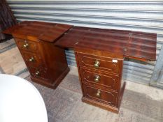 A pair of surprisingly heavy Walnut and Mahogany campaign design Stands having fold-out top