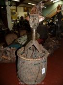 A Tribal Art Kota Mahongwe reliquary figure with basket (metal sheathing slightly weathered) having