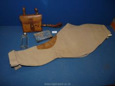 An antique fox hunting leather,