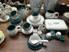 A part Denby "Greenwheat" dinner service including jugs, sauce boat, plates (one a/f), cups,