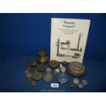 A variety of collector's weights, accompanied with scales and measures booklet.