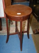 An Edwardian Mahogany occasional/lamp Table having lightwood stringing,