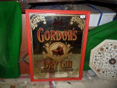 A 20th c. 'Gordon's Dry Gin' multicoloured mirrored advertising sign, 19 1/2" x 25 1/2".