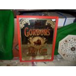 A 20th c. 'Gordon's Dry Gin' multicoloured mirrored advertising sign, 19 1/2" x 25 1/2".